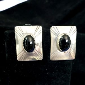 Silver post earrings.